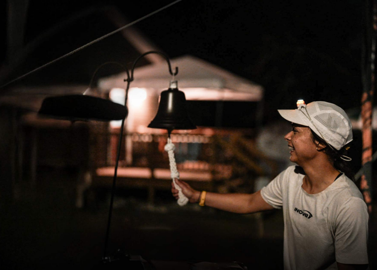 INOV8 Athlete Sarah Perry ringing a bell to celebrate breaking the UK's record