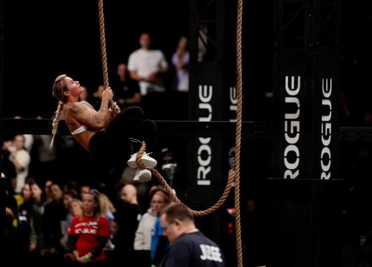 INOV8 Athlete Dani Speegle performing a rope climb at Rogue Invitational 2025