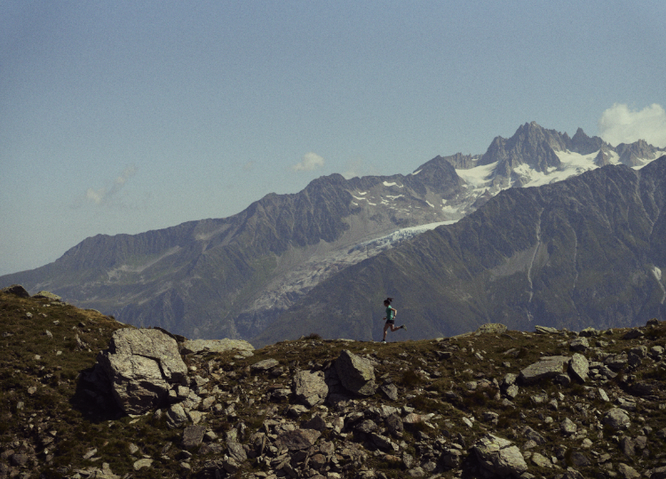 Runner running along a ridgeline in Chamonix mountains, France