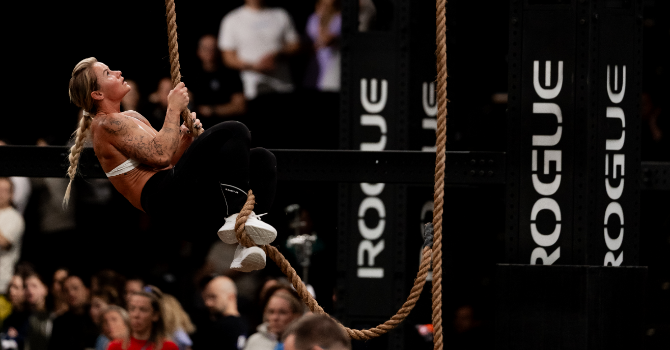 INOV8 Athlete Dani Speegle performing a rope climb at Rogue Invitational 2025
