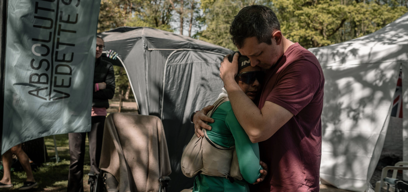 INOV8 Athlete Sarah Perry, embraced by her partner Luke after tapping out at 76 laps.