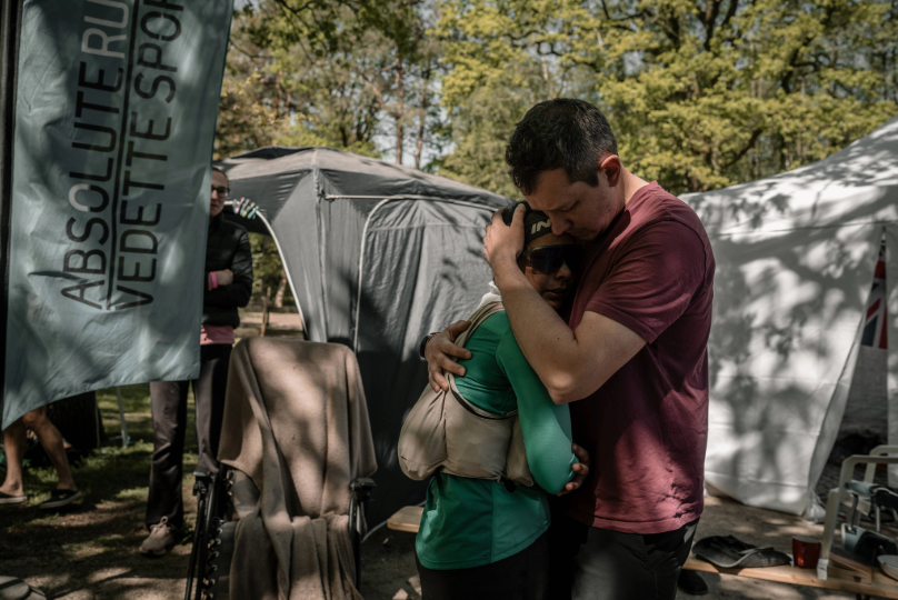 INOV8 Athlete Sarah Perry, embraced by her partner Luke after tapping out at 76 laps.