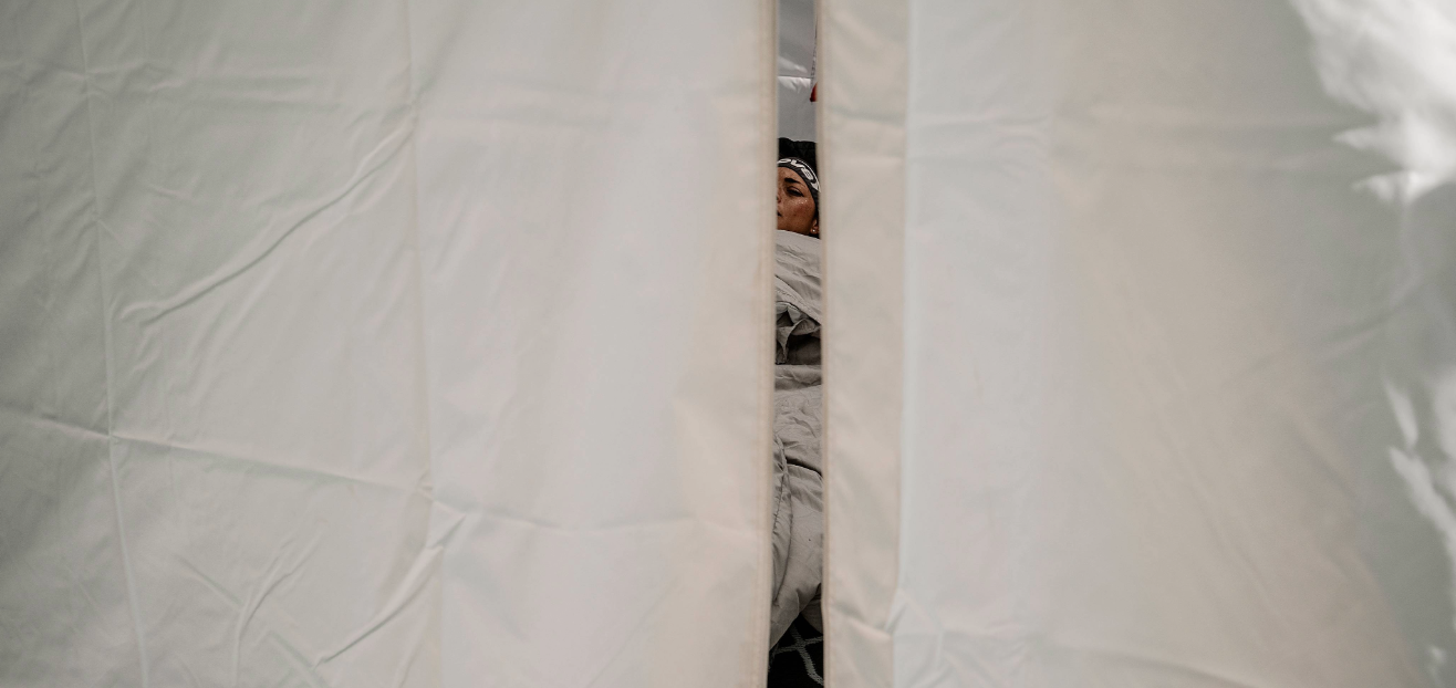 Sarah Perry resting in her support tent at Legends Backyard Ultra 2026