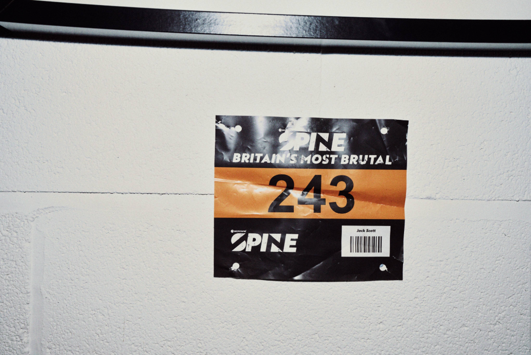 The winning race number from 2024, hung up in the home gym of Jack Scott, for extra motivation. Photo by Ryan Edy.