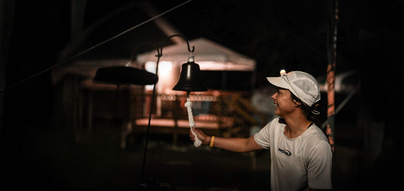 INOV8 Athlete Sarah Perry ringing a bell to celebrate breaking the UK's record