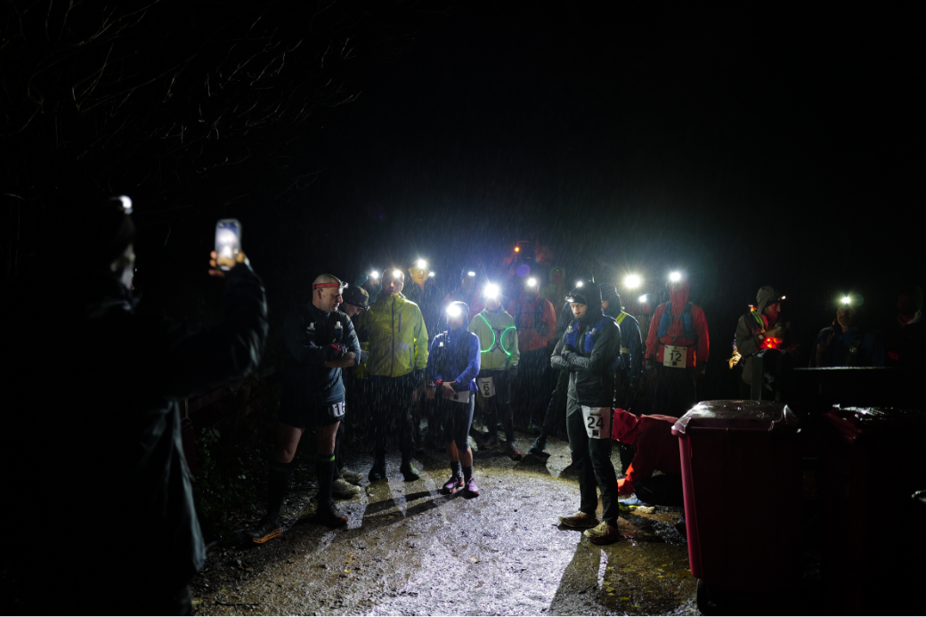 Runners gathering at the bottom of the Hill in the pouring rain - waiting for the event to start.