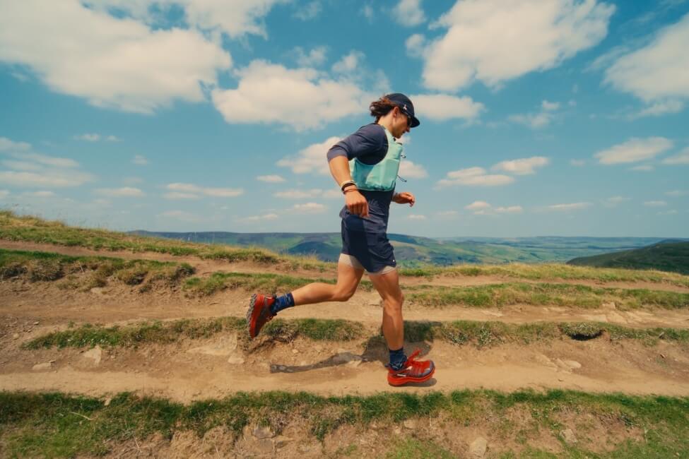 Ultra runner Tommy Lewis running in the hills