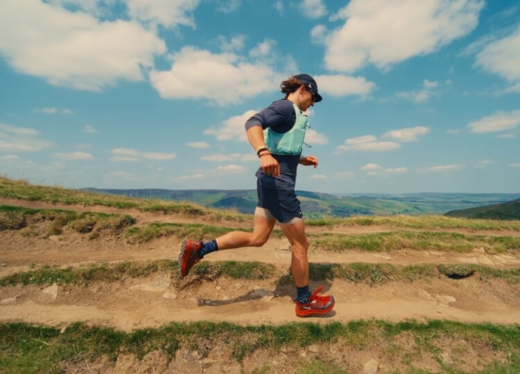 Ultra runner Tommy Lewis running in the hills