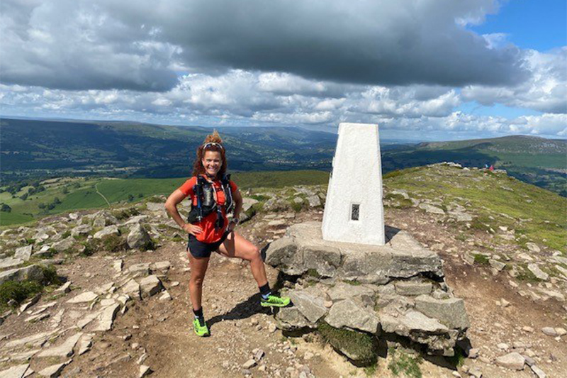Sabrina at the top of a mountain