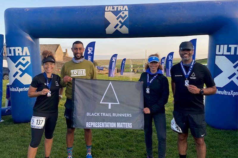 Sabrina with the black trail runners team