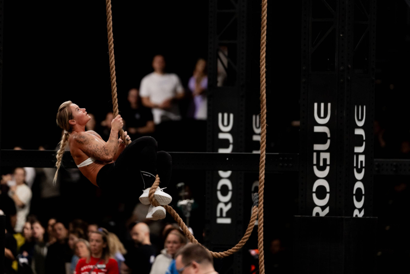 Dani Speegle performing a rope climb at Rogue Invitational 2025