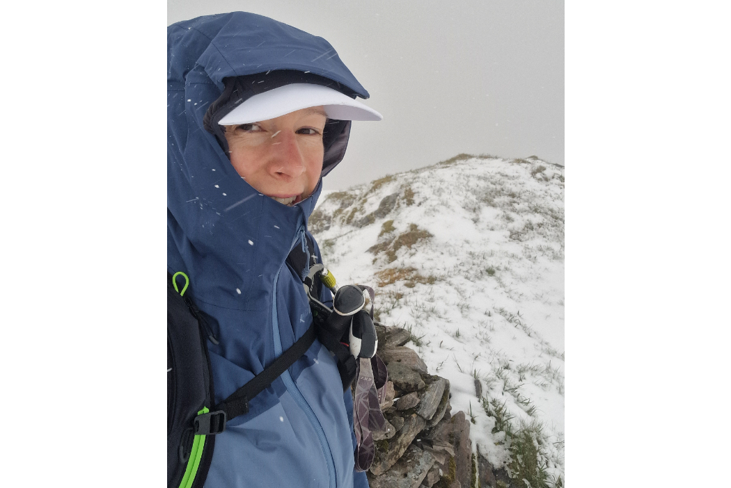 Nic Hardy surrounded by snow on a munro