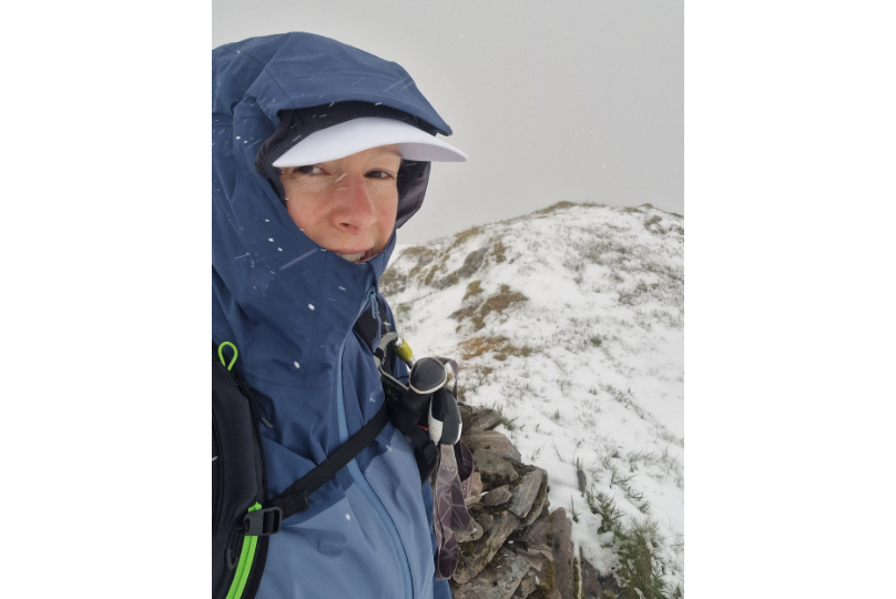 Nic Hardy surrounded by snow on a munro