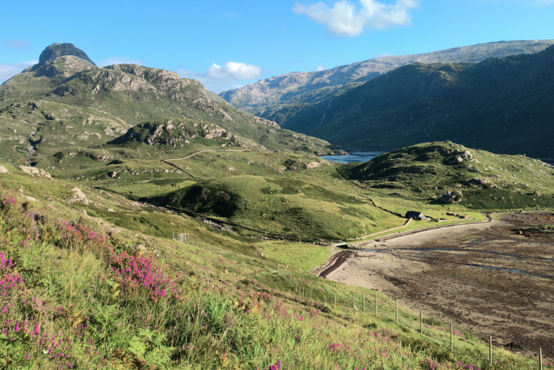 Green Scottish landscape with blue skies