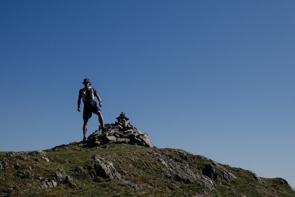 Tommy Run PT standing on the summit of a hill