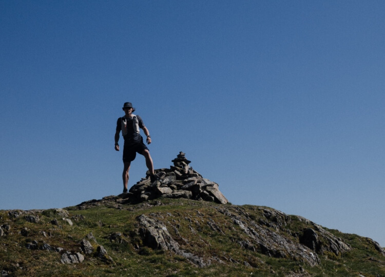 Tommy Run PT standing on the summit of a hill