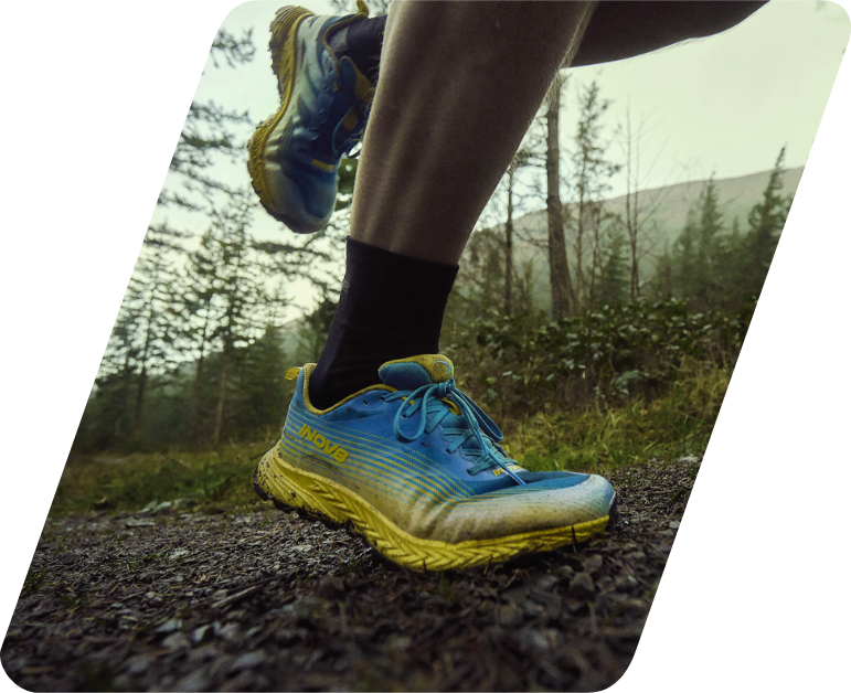 A woman running on a trail in Trail Speed
