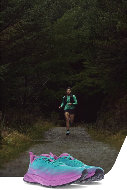 A man running on a trail in Trail Speed Shoes